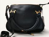 an image of a black handbag with a black strap