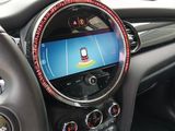 the interior of a car with a steering wheel and dashboard controls