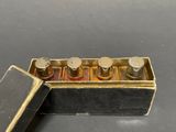 a small box that has five bottles of perfume in it