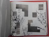 an open book with black and white images on it
