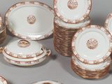 many plates and bowls that are sitting on a table