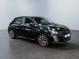 the black car is parked in a white room with a black floor