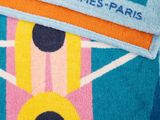 a towel that has a picture of a tennis racket on it
