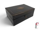an image of a black box with a gold emblem on it