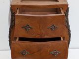 an image of a wooden chest of drawers with a drawer underneath it