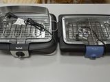 two grills that are sitting on a table