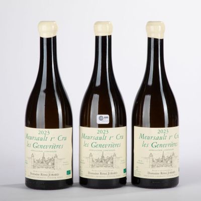 three bottles of wine sitting next to each other on a table