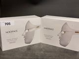 two boxes of noorance products on a table with a clock in the background