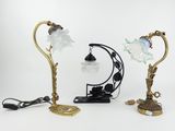 three lamps that are sitting next to each other on a table