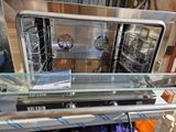 a silver oven that is on display in a store