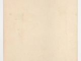 an old piece of paper on a white surface
