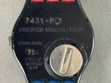 a red and blue watch with a button on it