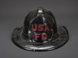 an old fire helmet with the word usa fd written on it