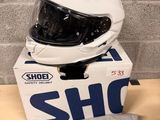 the helmet is sitting on top of the box on the table