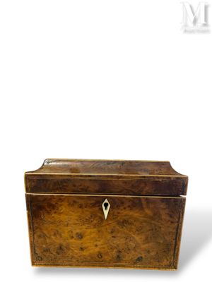 an old wooden box with a lock on top of it