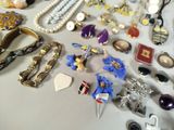 many different types of jewelry on a table