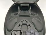 a black case with a game controller inside of it