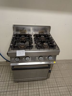 a silver stove with two burners on it in a kitchen