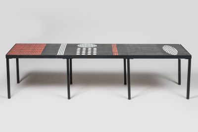 a black table with red and white squares on it
