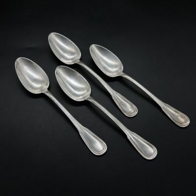 a set of five silver spoons with a long handle
