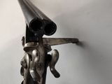 a gun mounted on a wall in a room