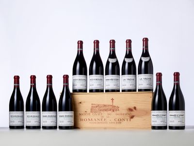 a bunch of bottles of wine in a wooden box
