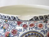 a close up of a bowl with a floral design on it