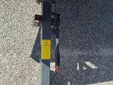 a close up of a green trailer with a yellow tag on it