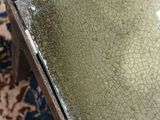 a glass table with a cracky surface on top of it
