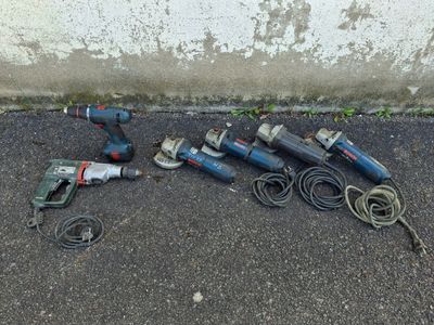a lot of tools that are laying out on the ground