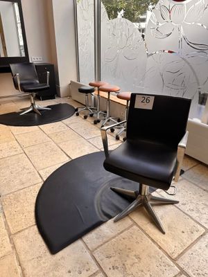 an image of a salon with a chair and a mirror