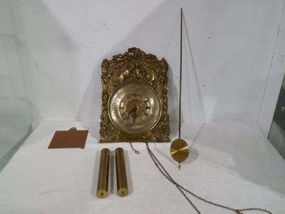 a clock that is sitting on a table with a chain around it