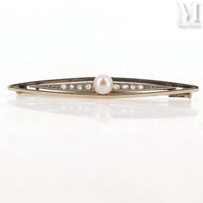 an image of a pearl and diamond hair clip on a white surface