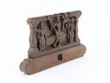 an image of a sculpture of a group of people on a wooden stand