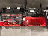 a red tool box with tools in it on the floor