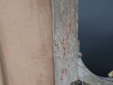 a close up of a wooden door with a metal handle