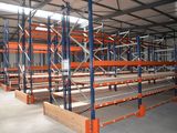 an image of a large warehouse filled with lots of shelves