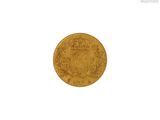 a close up of a gold coin on a white background