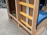 a chair that has been built into the side of a building