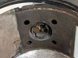a close up of a metal pot with a hole in it