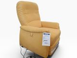 a yellow recliner chair with a label on the back of it