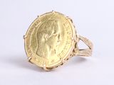 an image of a gold coin ring with a woman ' s face on it