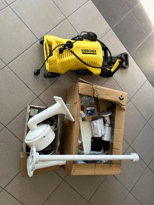 a box of toilet paper and a blower on the floor