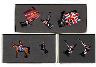 several figurines of people riding horses and holding flags in a box
