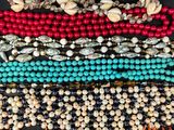 a close up of a bunch of beads on a table
