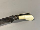 a knife that is sitting on a table