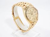 an image of a gold rolex watch with roman numerals