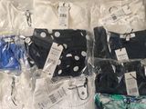 several pairs of underwear are wrapped in plastic bags on a table