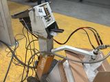 a machine that is sitting on the ground in a warehouse