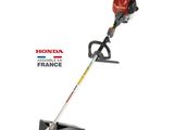 a red and black string trimmer on a white background